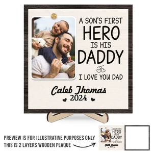 Custom Photo A Son's First Hero Is His Daddy - Family Personalized Custom 2-Layered Wooden Plaque With Stand - Gift For Dad